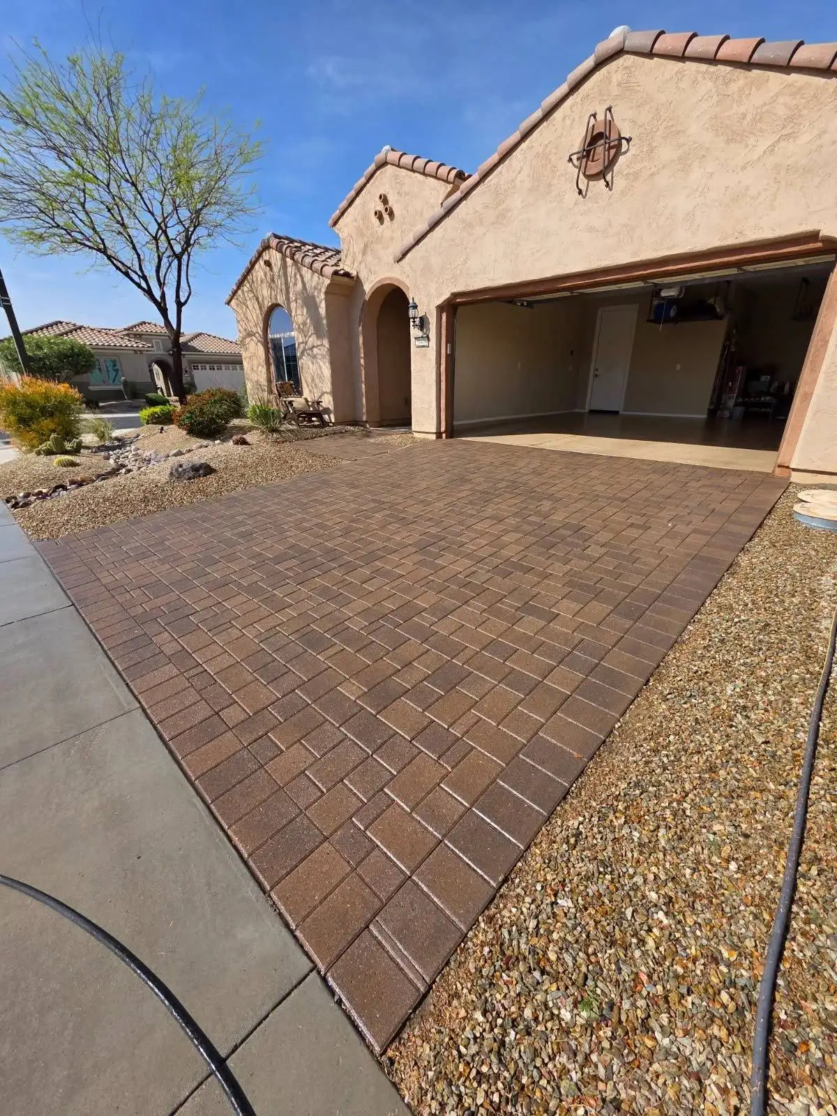 Real Patriot driveway paver sealing project in Sun City Festival